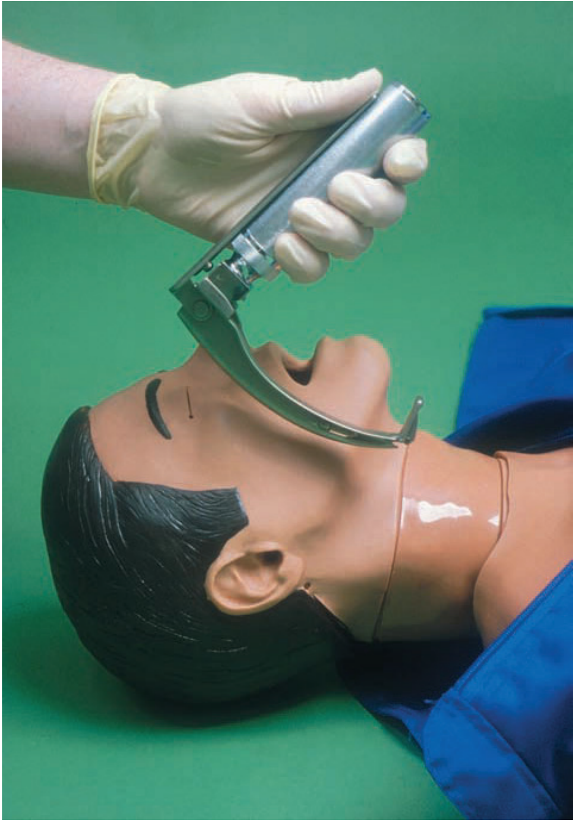 Person wearing gloves using McCoy blade with hinged tip on a mannequin